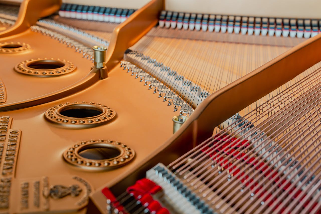 Close-up of grand piano strings and soundboard capturing intricate details of musical craftsmanship.